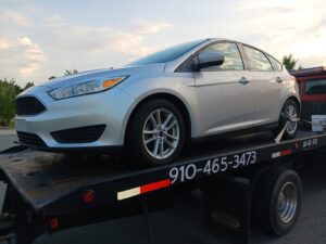 A close up of a vehicle on the All Star Towing truck bed