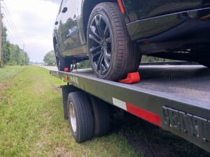 A close up of a vehicle on the All Star Towing truck bed