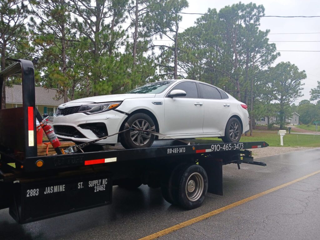 All Star Towing company truck carrying a vehicle